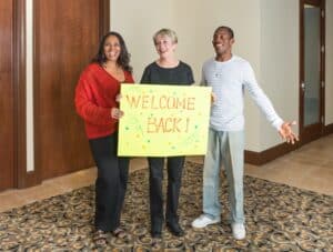 High school alumni and teacher reconnect at a 20 year reunion