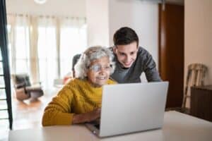Grandson And Grandma with Laptop
