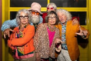 Seniors in a high school reunion photo booth